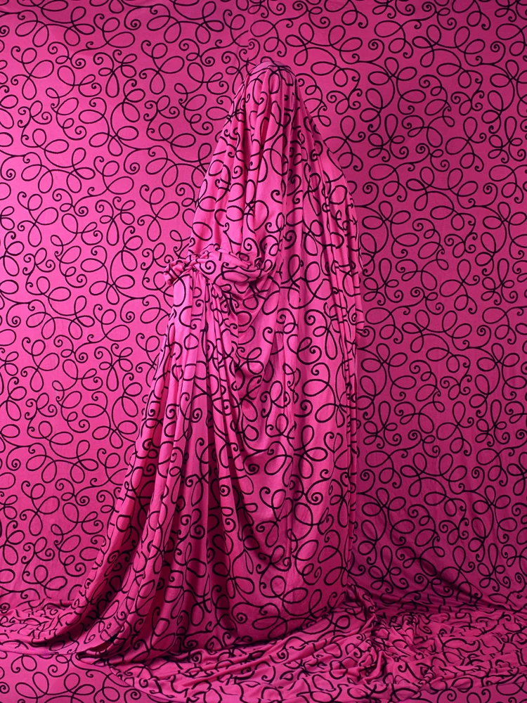magenta squiggly pattern fabric ghost model on coordinated background
