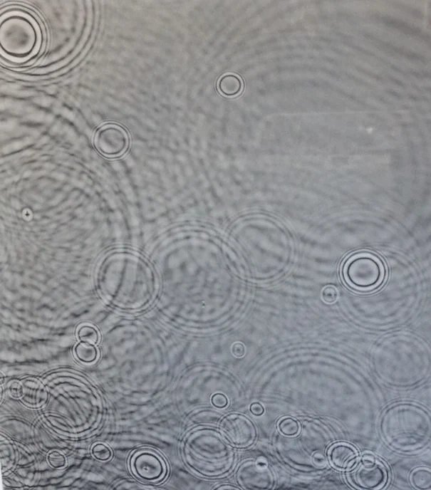 caustics of water droplets on surface repeated as shadows