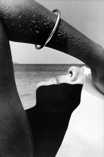 womans arm face beach