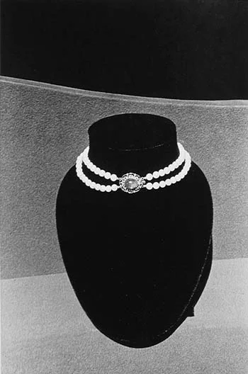Pearl Necklace on velvet stand
