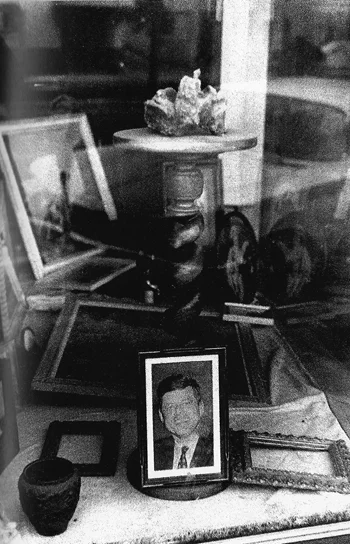furniture store window small framed jfk photo