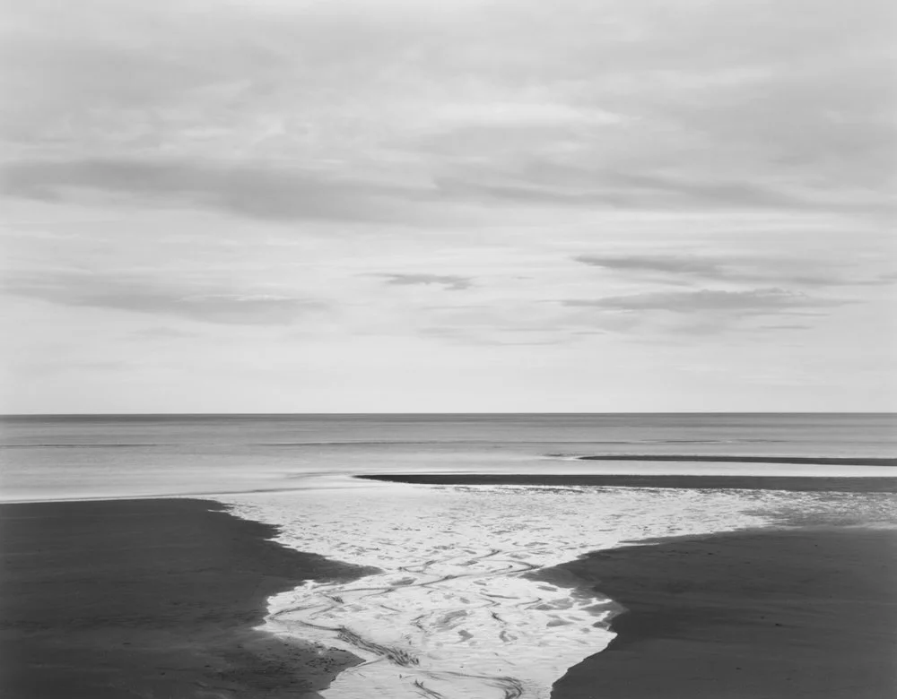 water going out to sea from beach