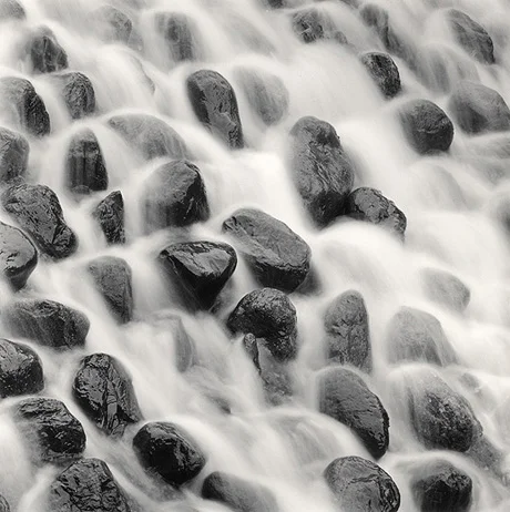 waterfall mist over rocks