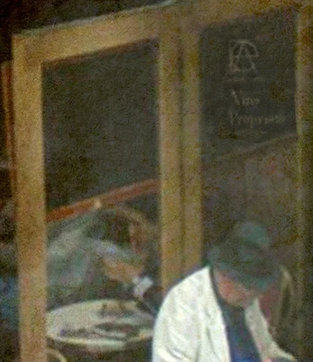 man reading newspaper street cafe