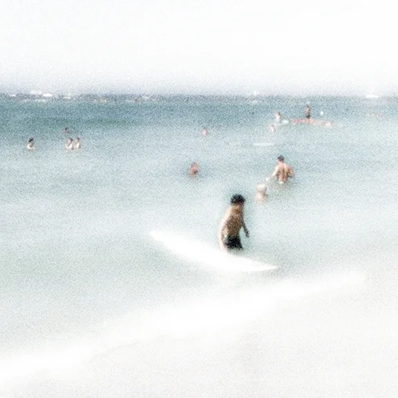 beachscape man surfboard