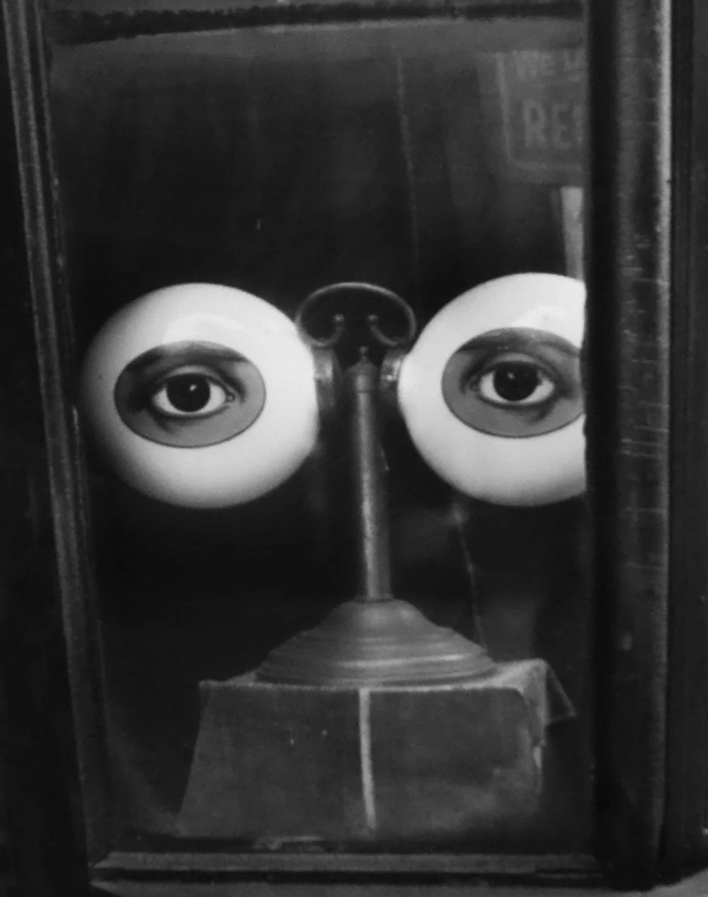 Optician's Window with painted eyes on spectacles shaped model