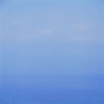 faint horizon subtle clouds blue seascape