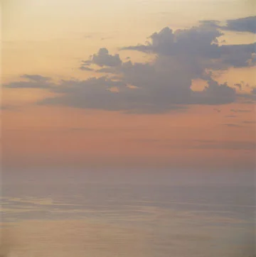 distinct pale blue clouds warm sky seascape