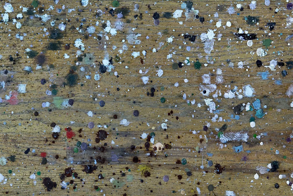 light paint splatters wooden floor