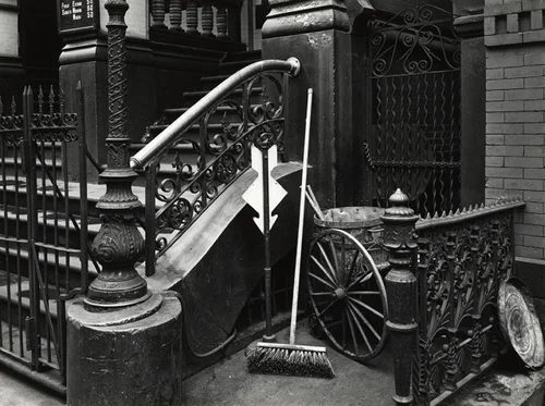 nyc street stoop detailed iron work broom