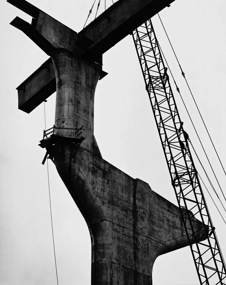 upward view construction pier white sky