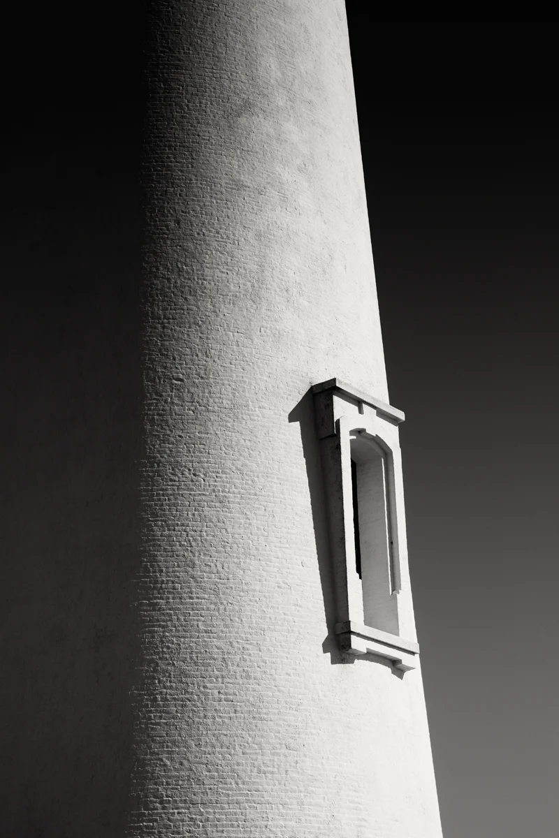 side lighthouse window against sky