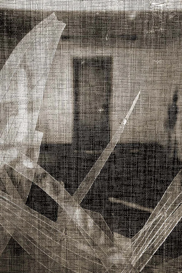 interior seen through screen with broken glass