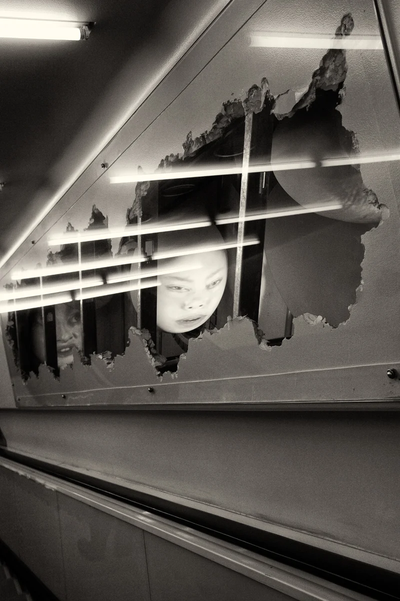 reflected face and fluorescent lights