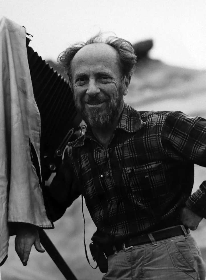 man wearing standing next to camera