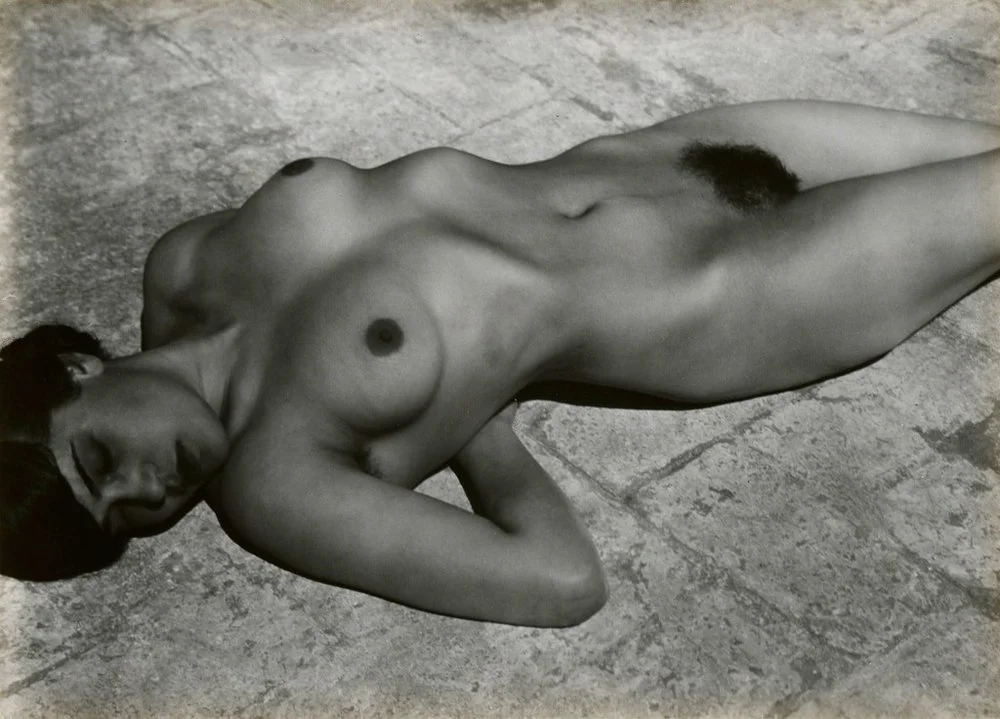 nude woman laying down