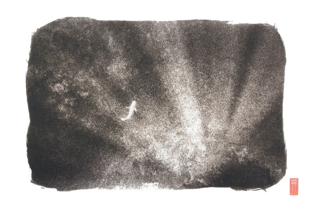 small white fish against light beams underwater
