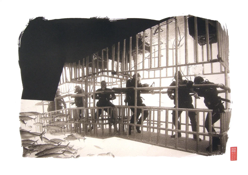 six suited divers in large cage underwater