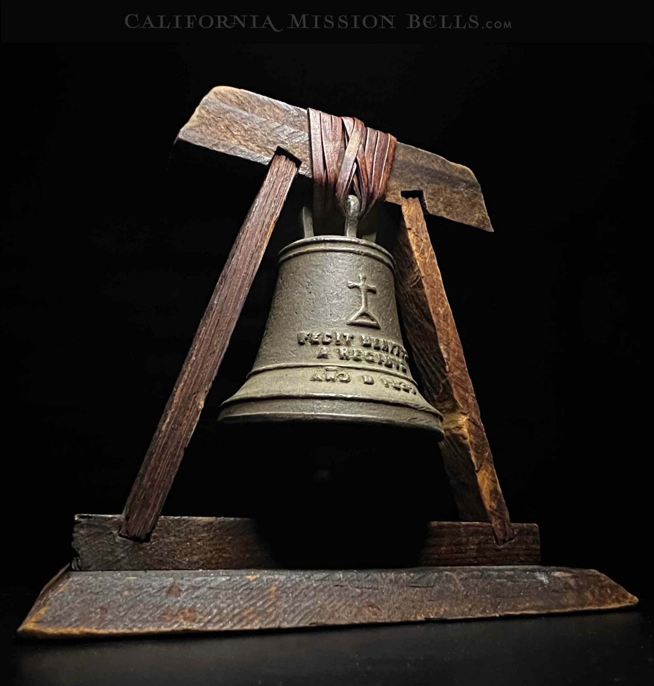 Antique Mission San Gabriel souvenir bell display.