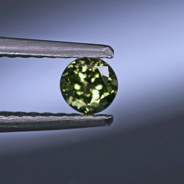 PallasitePeridot0.39ctroundII.jpg