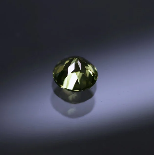 PallasitePeridot0.39ctroundIV.jpg