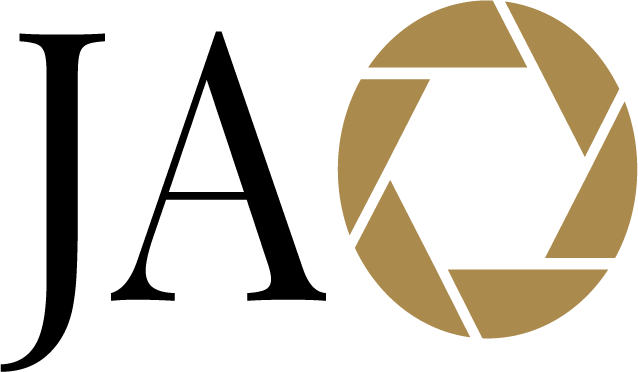 A camera lens illustration with a golden aperture icon next to the word "Camera".