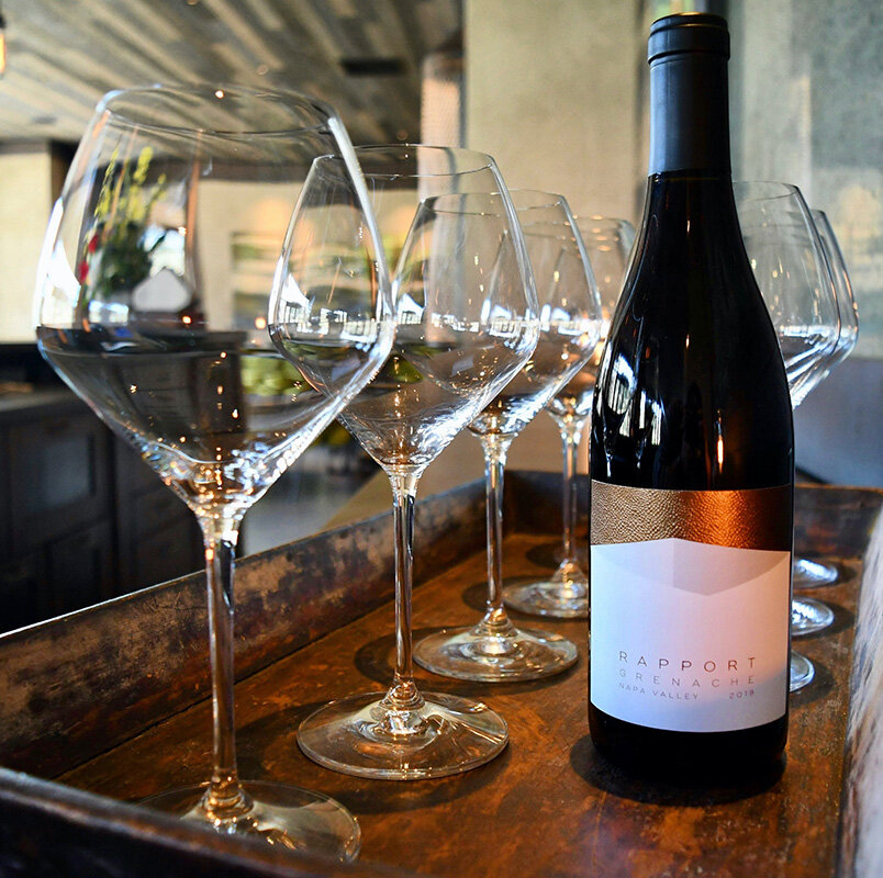 RAPPORT WINES | Wine glasses next to Napa Valley wine