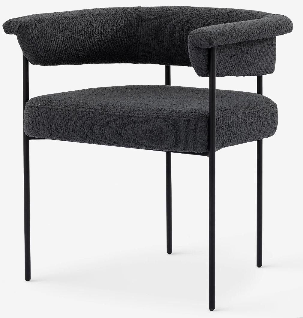 black boucle upholstered dining chair.JPG