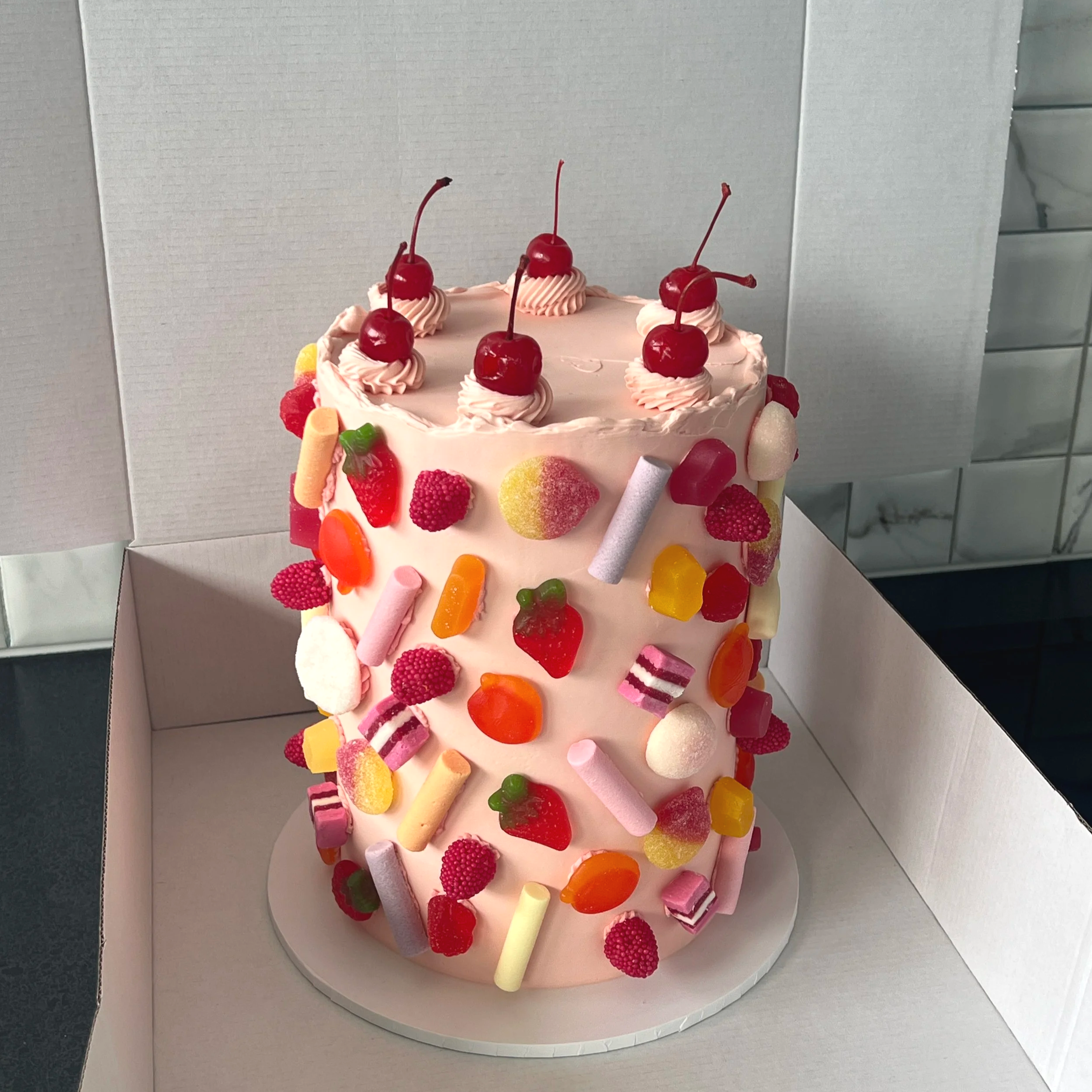 pink lolly covered cake