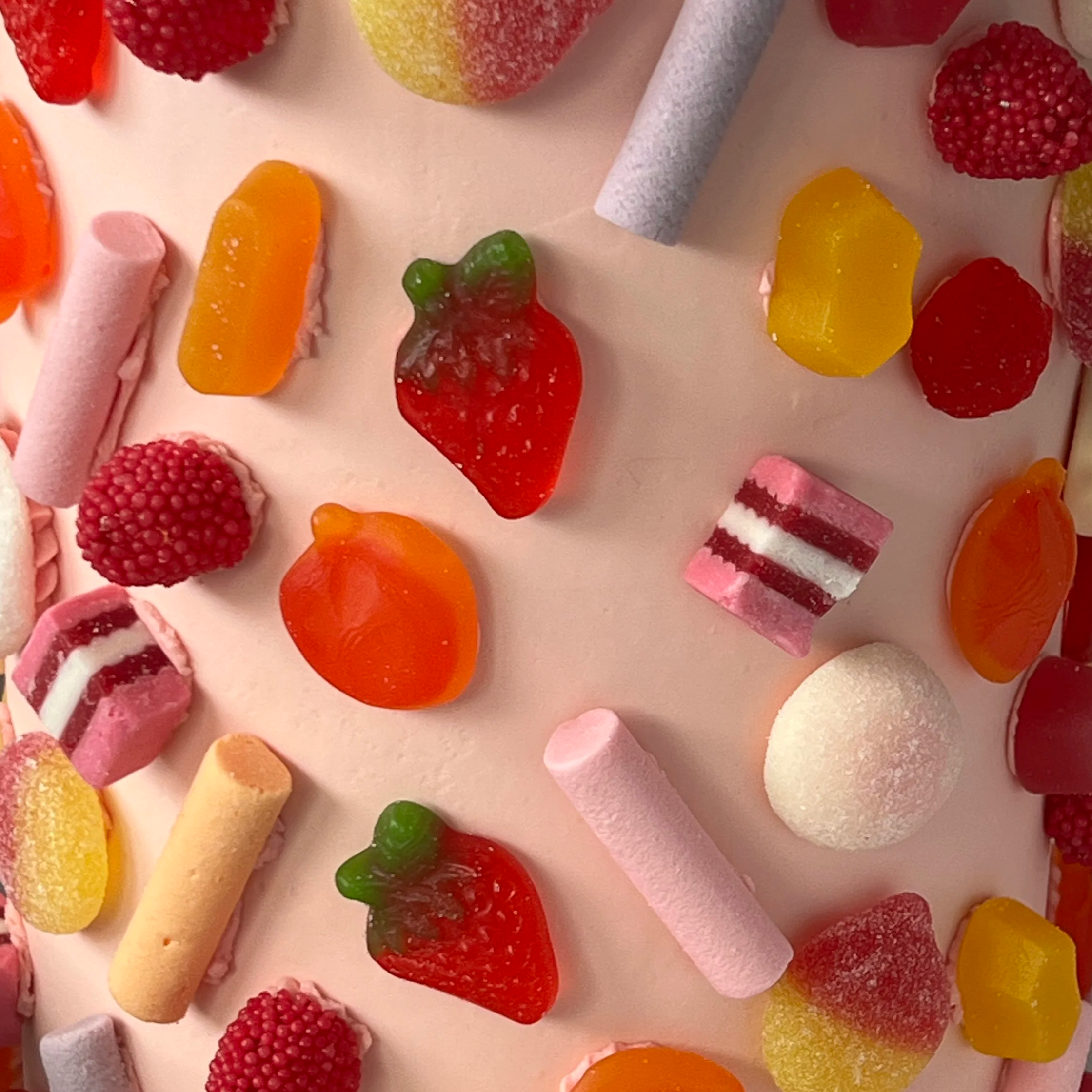pink lolly covered cake