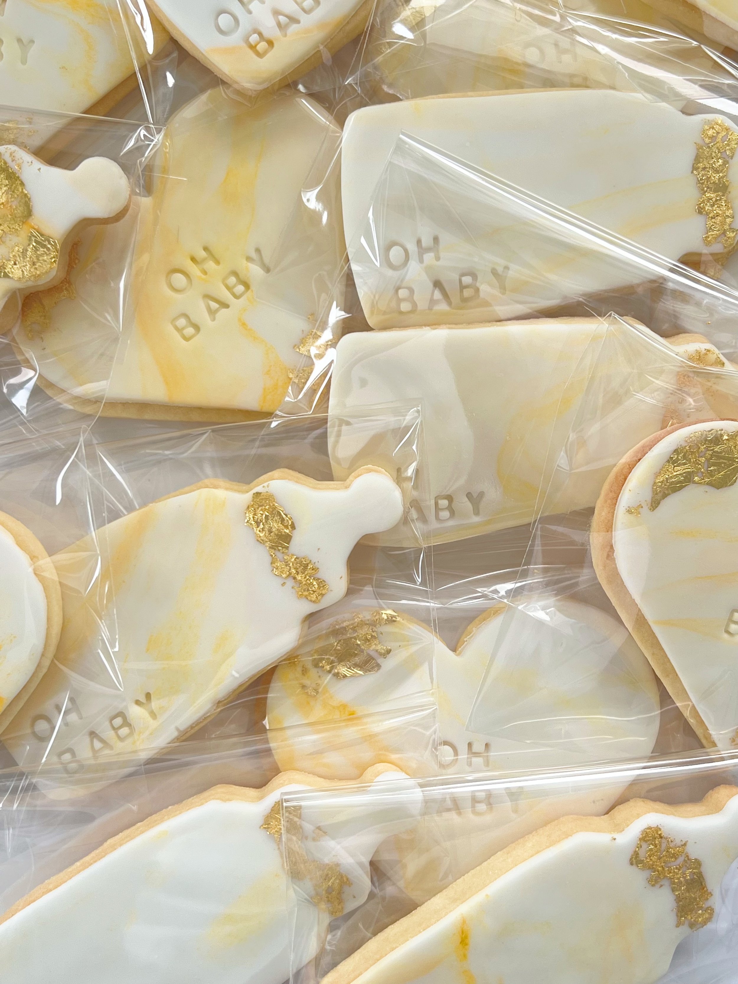 baby shower cookies heart white gold leaf yellow baby bottle sprinkles