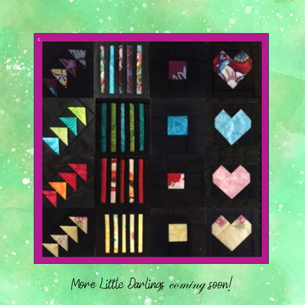 Little Darlings In-the-Hoop quilt blocks made from colorful scrapbuster strips on black fabric-2.