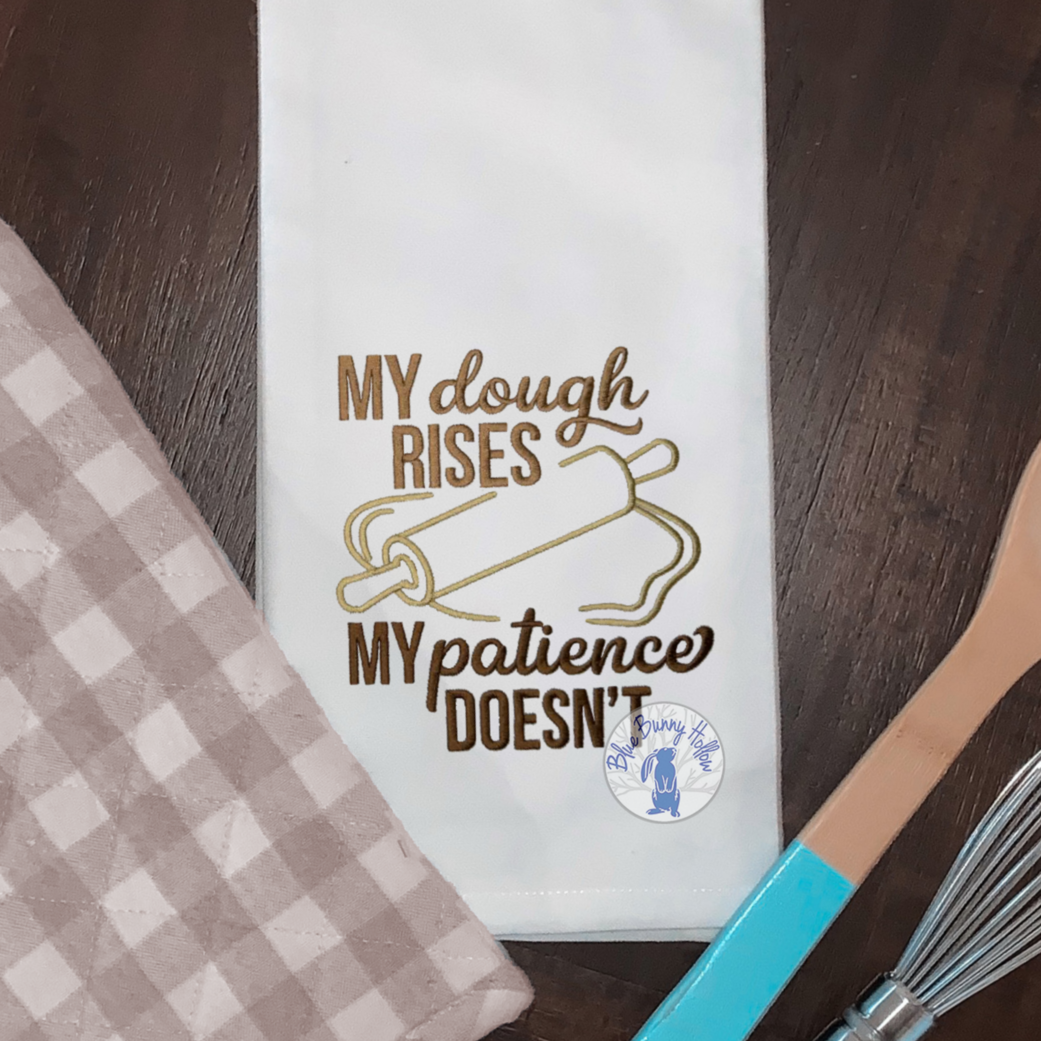 Funny baking embroidery design with rolling pin.