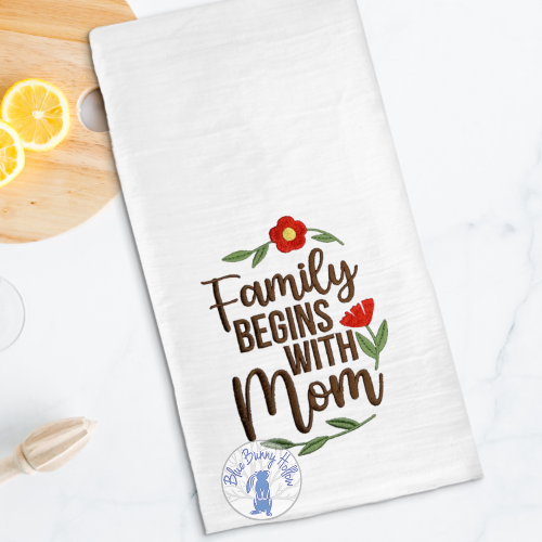 Family Begins with Mom embroidery design with flowers.