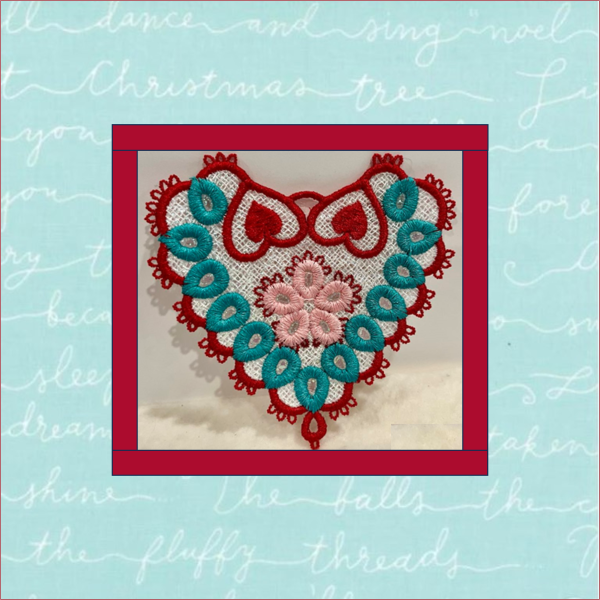 Free-standing lace heart motif machine embroidery design with Mylar sparkle in red, pink, turquoise, and white, featuring a hanging loop and tatted lace edging.