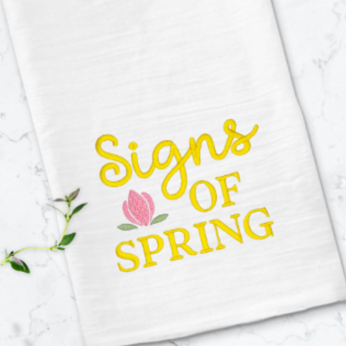Close-up of Signs of Spring embroidery stitching.