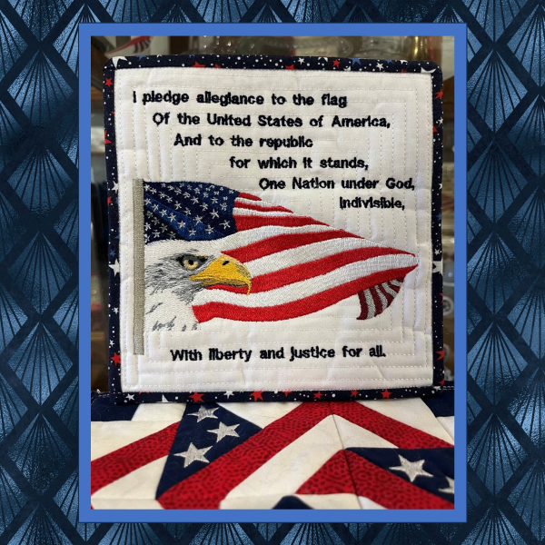 Machine embroidery mugrug featuring American flag, eagle, and Pledge of Allegiance text stitched in red white and blue patriotic theme