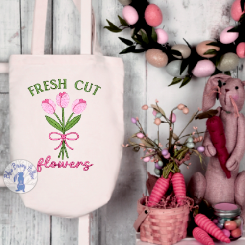 Spring floral embroidery with tulip bulbs tied together.