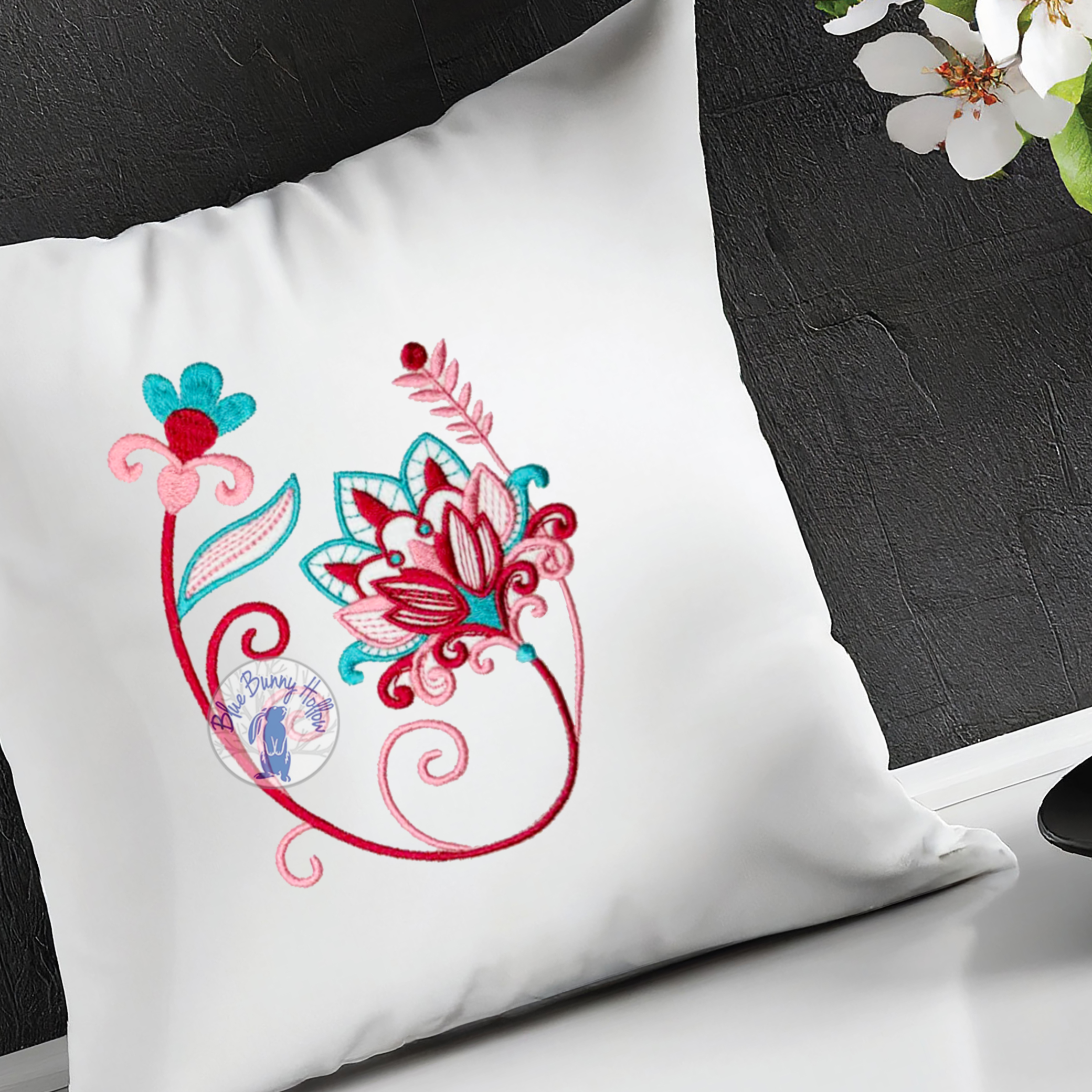 Artistic tropical floral embroidery design with vivid colorful flowers.