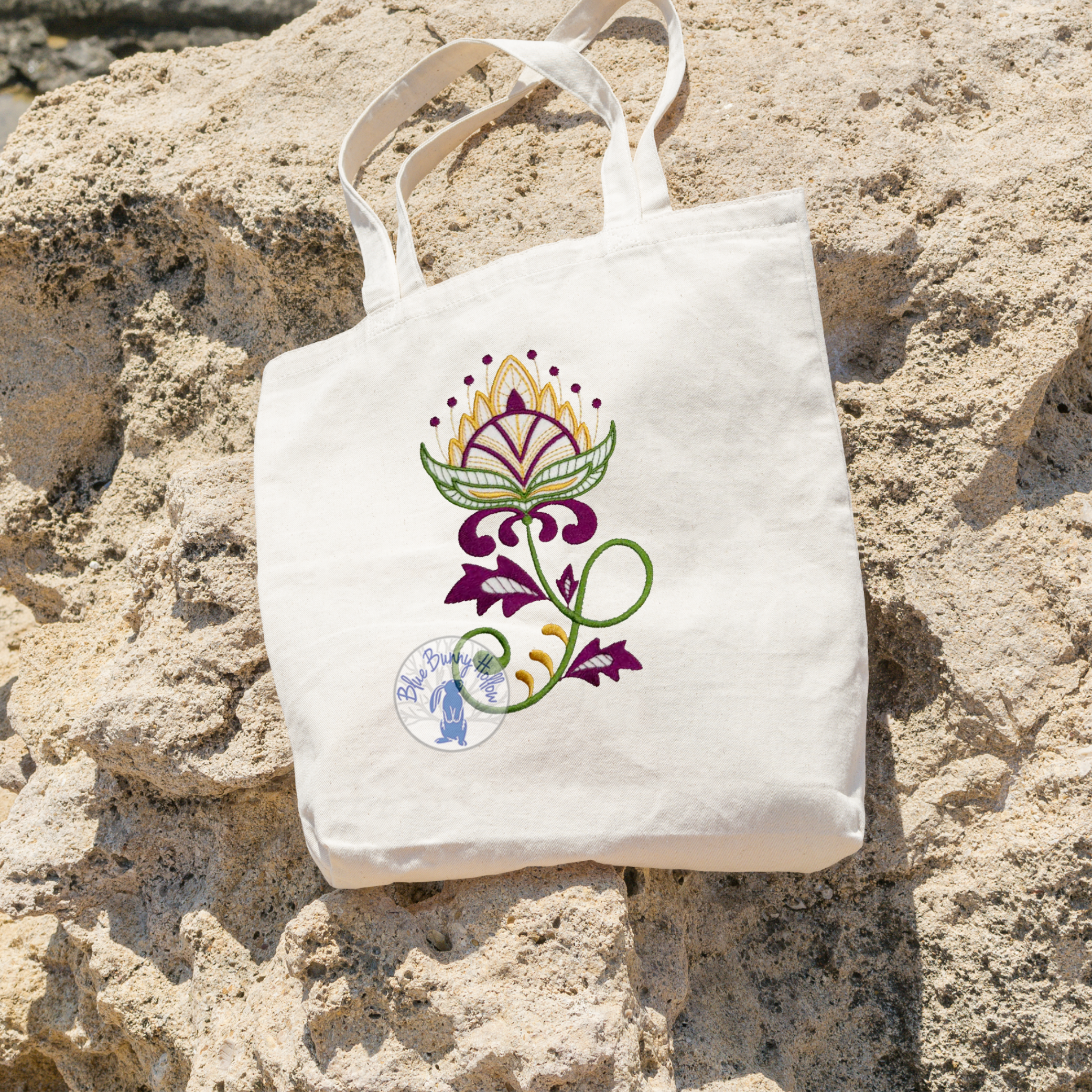 Artistic wildflower embroidery design with ornate floral details.