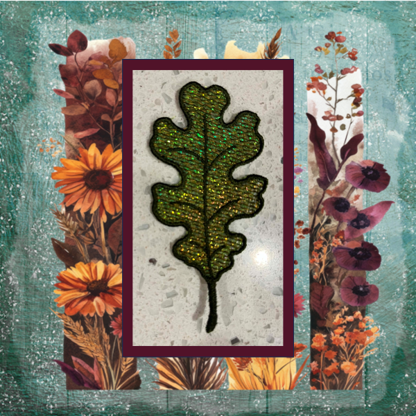 Lace oak leaf machine embroidery design with shimmering Mylar applique and delicate autumn lacework in green and gold.