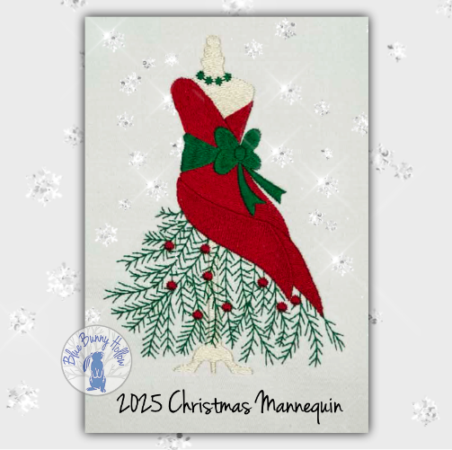 2025 Christmas Mannequin embroidery design featuring a red dress on an ivory mannequin with green bow, evergreen boughs, and holly berries. (Copy)