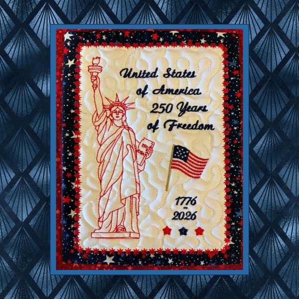 Patriotic in-the-hoop machine embroidery wall hanging featuring the Statue of Liberty in redwork with American flag and 250 years of freedom commemorative text.