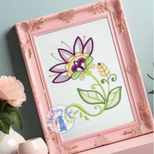 Vivid Tropical Flora embroidery design stitched in dark pink and yellow thread.