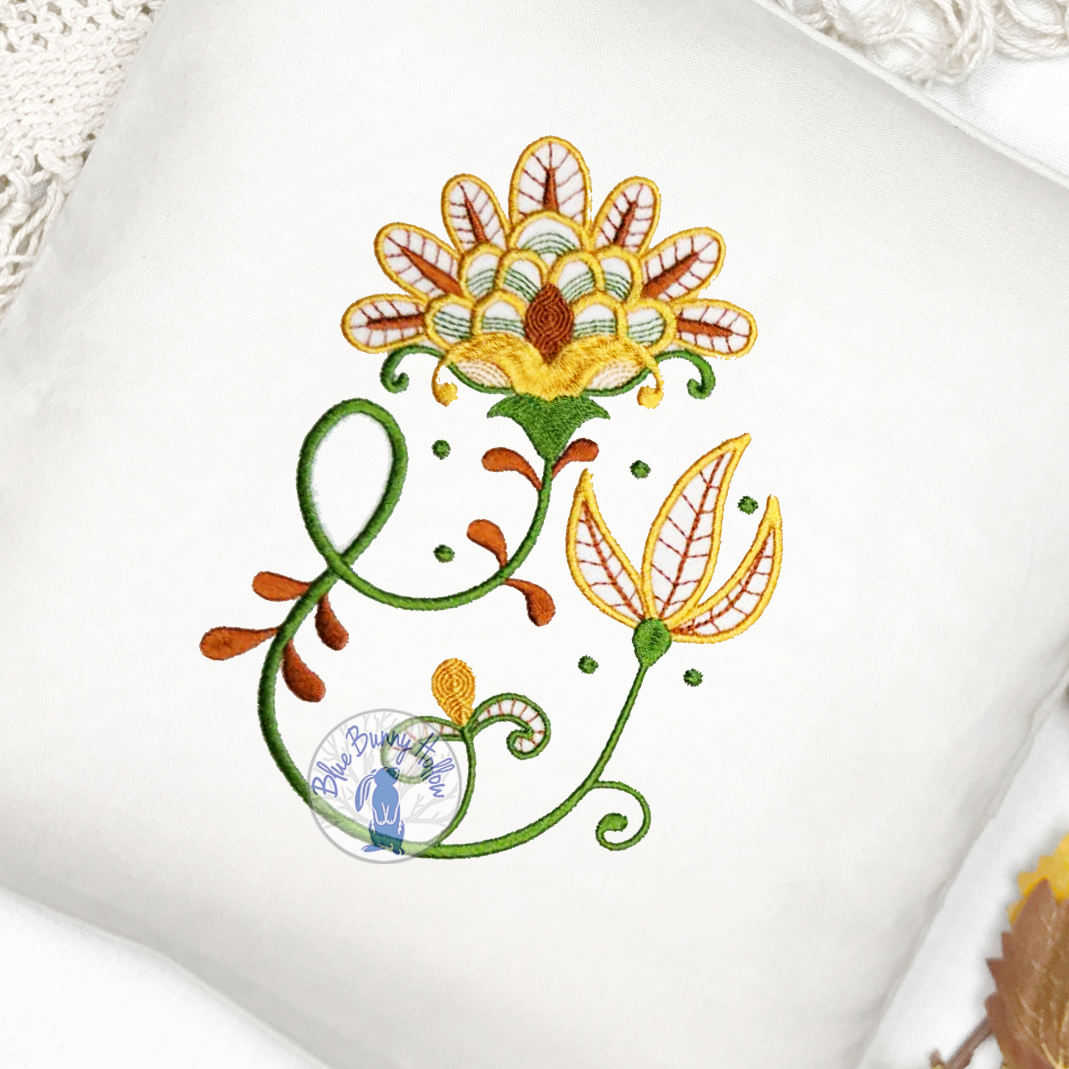 Artistic golden flower machine embroidery design for home décor.
