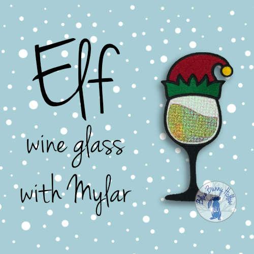 Elf wine glass embroidery design with Mylar sparkle and Christmas elf hat .