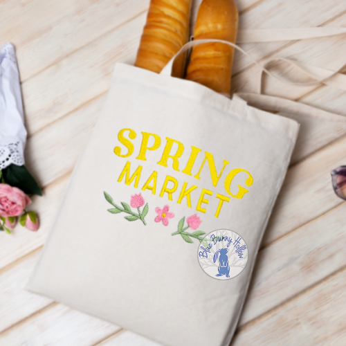 Floral spring embroidery design with decorative lettering.