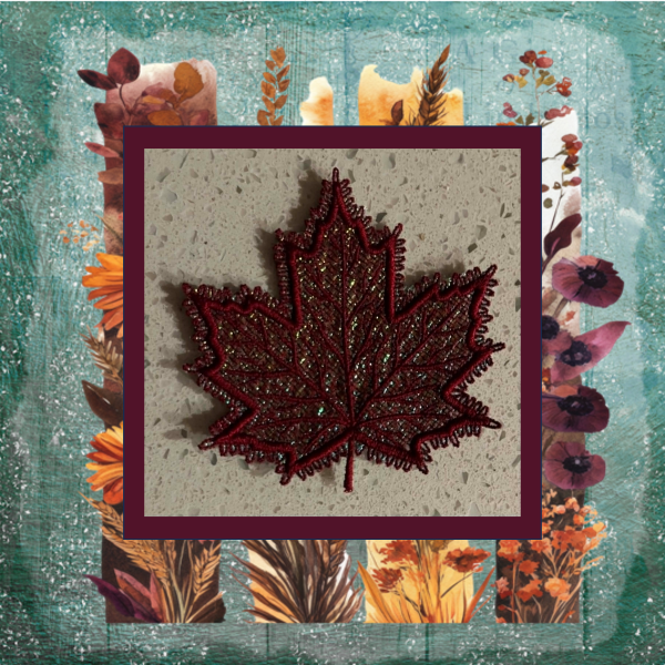 Burgundy lace maple leaf machine embroidery design with shimmering Mylar applique and tatted loop border.
