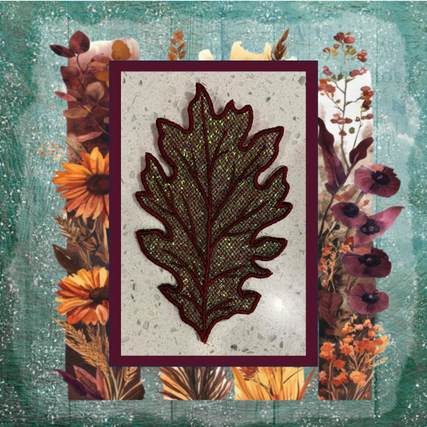 Lace oak leaf machine embroidery design with shimmering Mylar applique and delicate autumn lacework.