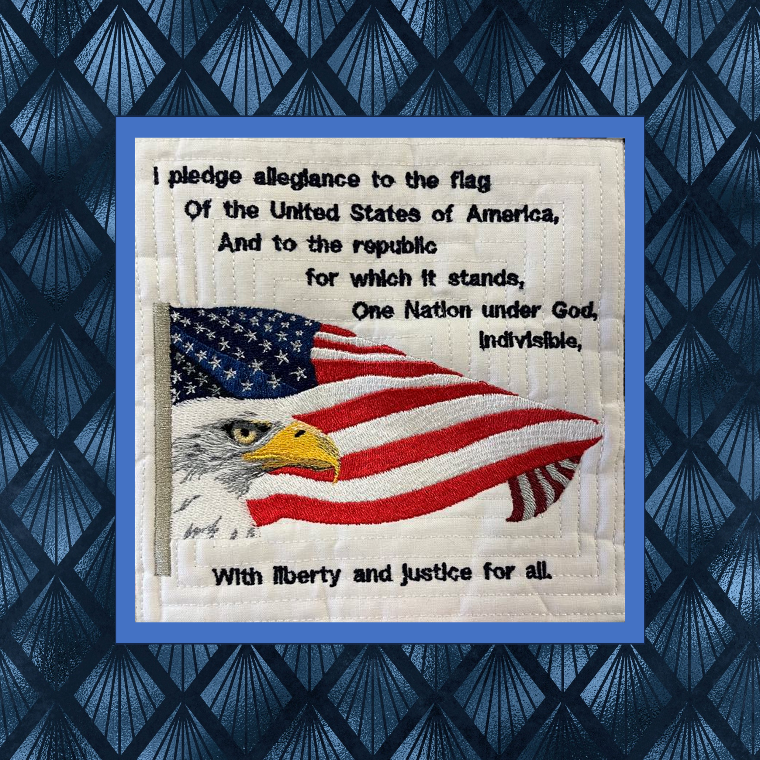 Machine embroidery quilt block featuring American flag eagle and Pledge of Allegiance in patriotic red white and blue design